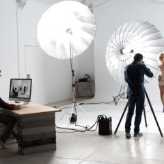 Photographer working with a Cute Model in a Professional Studio